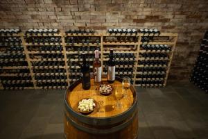a room with a bunch of wine bottles and glasses at Sklípek Nechory in Prušánky +18 photos