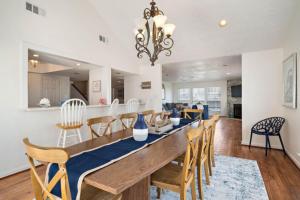 a dining room and living room with a long table and chairs at Secluded beachfront house with gorgeous ocean views in Galveston