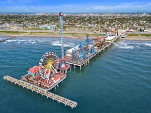an aerial view of a amusement park in the water at Modern condo right across from beach and pool in Galveston