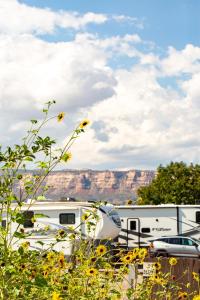 a white rv parked in front of a mountain at JW Grand Junction in Grand Junction