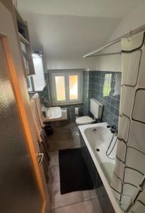 a bathroom with a tub and a toilet and a sink at Casa Angelica in Quinto