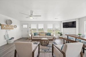 a living room with a couch and a table at Bright and Cozy 4 Bedroom close to the Ocean in Galveston