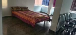 Ένα ή περισσότερα κρεβάτια σε δωμάτιο στο Six Face Guest House