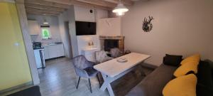 a living room with a couch and a table at La Merveille 795-848-628 in Solina