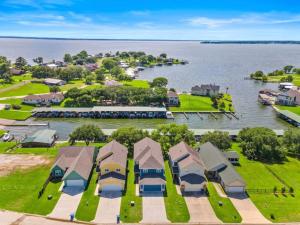 an aerial view of a resort with a body of water at Beautiful home with lake views and in-ground pool in West Livingston