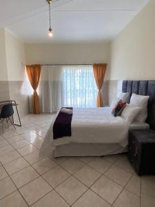 Postel nebo postele na pokoji v ubytování Cosy Retreat