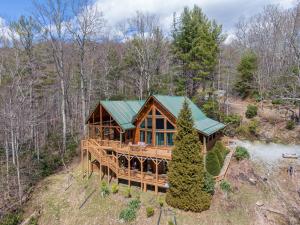 an overhead view of a large wooden house in the woods at Beary Relaxing Cabin in Banner Elk