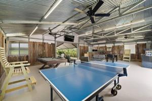 a ping pong room with a ping pong table at Waterfront beach house with the ultimate game room and two docks in Oyster Creek
