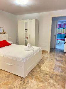 Ένα ή περισσότερα κρεβάτια σε δωμάτιο στο Expoholidays - Estudio loft moderno