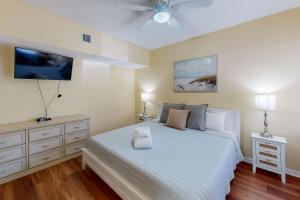 a bedroom with a bed and a ceiling fan at Anchorage 7449 in Hilton Head Island