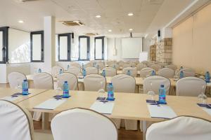 a conference room with tables and chairs with water bottles on them at Sercotel Maya Alicante in Alicante +49 photos