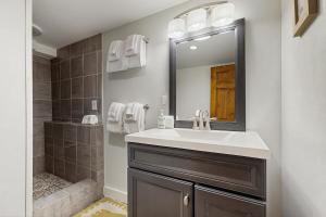 a bathroom with a sink and a shower at Chasing the Slopes in North Woodstock +18 photos