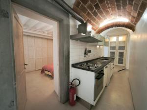 a kitchen with a stove and a stove top oven at Sassoverde 9 in Arezzo