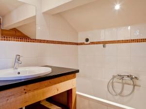 a bathroom with a sink and a bath tub at Chalet rénové 3 chambres, proche centre Courchevel - FR-1-514-25 in le Praz