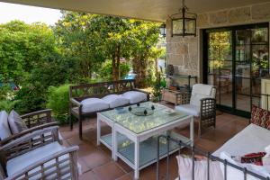 a patio with chairs and a table on a patio at VillaDonas in Gondomar