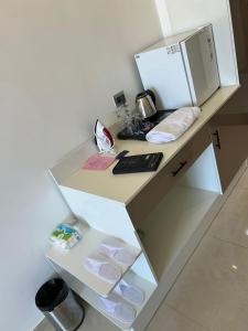 a white desk with a computer on top of it at Celestia Omaxe in Lucknow