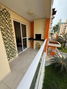 a view of a balcony of a building at Apartamento na Praia Grande Ubatuba in Ubatuba