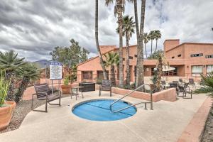 a patio with a small pool with chairs and a table at 3 Mi to Sabino Canyon Condo with Resort Perks! in Tucson