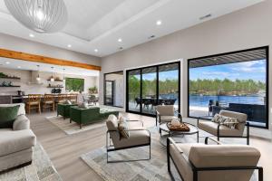 a living room with a view of a lake at Salience Path w/Heated Pool & Game Room in Mooresville