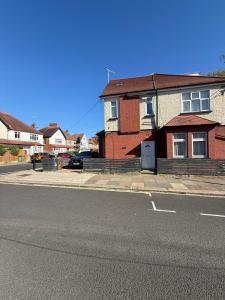 a brick house on the side of a street at Cozy Flat near Harrow-on-the-Hill Station in Harrow
