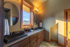 a bathroom with a sink and a window at Bailey's Creek Lodge in Blowing Rock +50 photos
