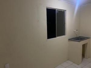 a white room with a window and a sink at Hotel Renascer pojuca in Pojuca +10 photos