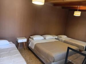 Postel nebo postele na pokoji v ubytování Hostal Purilackti