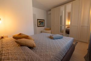 Postel nebo postele na pokoji v ubytování Lu Furru Apartments