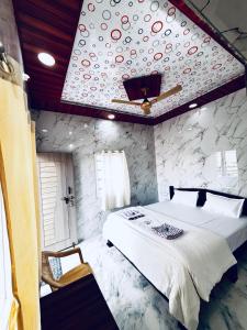 Ένα ή περισσότερα κρεβάτια σε δωμάτιο στο Manjunath Homestay