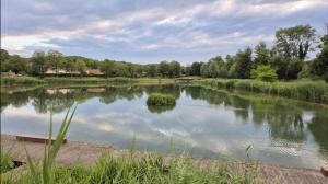 a view of a river with a boat in it at Studio à Disneyland Paris in Coupvray +6 photos
