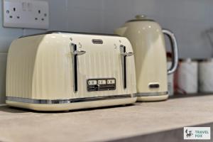 two toasters sitting on top of a kitchen counter at Becky's House: Near Motor Point Arena with Free Parking in Nottingham
