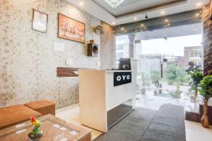 a living room with a couch and a table at SPOT ON Hotel Umang in Zirakpur