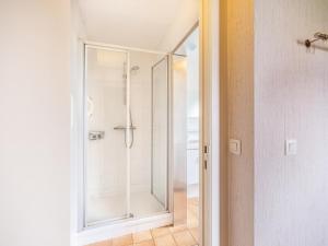 a shower with a glass door in a bathroom at La Paix in Sint-Idesbald +16 photos