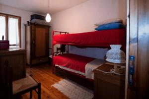 Una cama o camas en una habitación de Case Gran Paradiso Rhemes Notre Dame Bruil