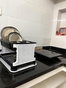 a washing machine sitting on a counter in a kitchen at Paripuranam in Tiruvannāmalai