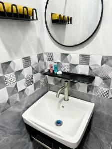 a bathroom with a sink and a mirror at Lunavista Homestay Jitra in Jitra