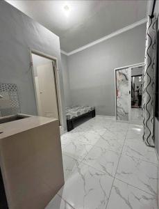 a room with a counter and a marble floor at Sewindu in Ramekasan