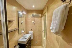 a bathroom with a sink and a mirror at Kai Etxea , el mismo puerto de Bermeo in Bermeo +22 photos
