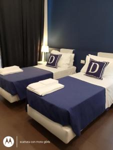 En eller flere senge i et værelse på I DIOSCURI