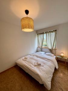 Postel nebo postele na pokoji v ubytování Simple and Cozy Flat in Zurich