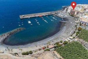 an aerial view of a harbor with boats in the water at Apartamento Playa San Juan WIFI in Playa de San Juan