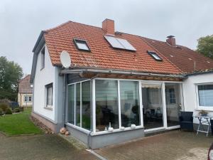a house with sliding glass doors on it at Haus Sommerfeld in Gültz