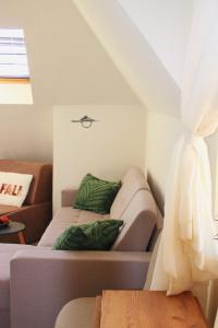 a room with a bed and a couch and a window at Lucy in Sandanski