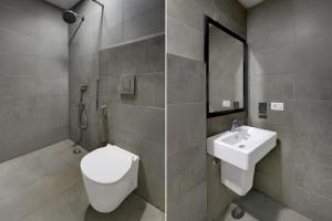 a bathroom with a toilet and a sink at Collection O Singha Crossway Formerly Hotel Star Key in Gurgaon +1 photo