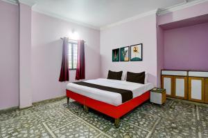 Ένα ή περισσότερα κρεβάτια σε δωμάτιο στο HOTEL O REEYH INN