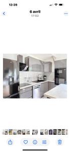 サン・ボネ・ド・ミュールにあるAppartement rdj 3 couchages proche eurexo saint exuperyのキッチン(ステンレス製の電化製品、白いキャビネット付)