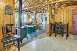 a kitchen and living room with a stove in a room at Boat, Hike and Fish Rustic Greenwood Retreat in Arlington +21 photos