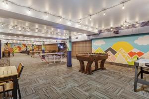 a room with a pool table and ping pong balls at Best Western Plus West Edmonton in Edmonton
