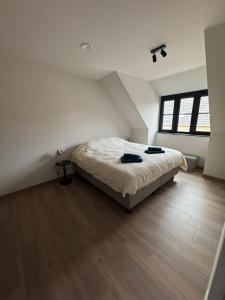 Giường trong phòng chung tại Maison frère