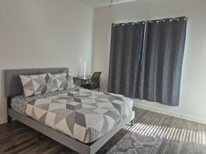 a bedroom with a bed and a window at Cozy Stay in Heart of Leander in Leander